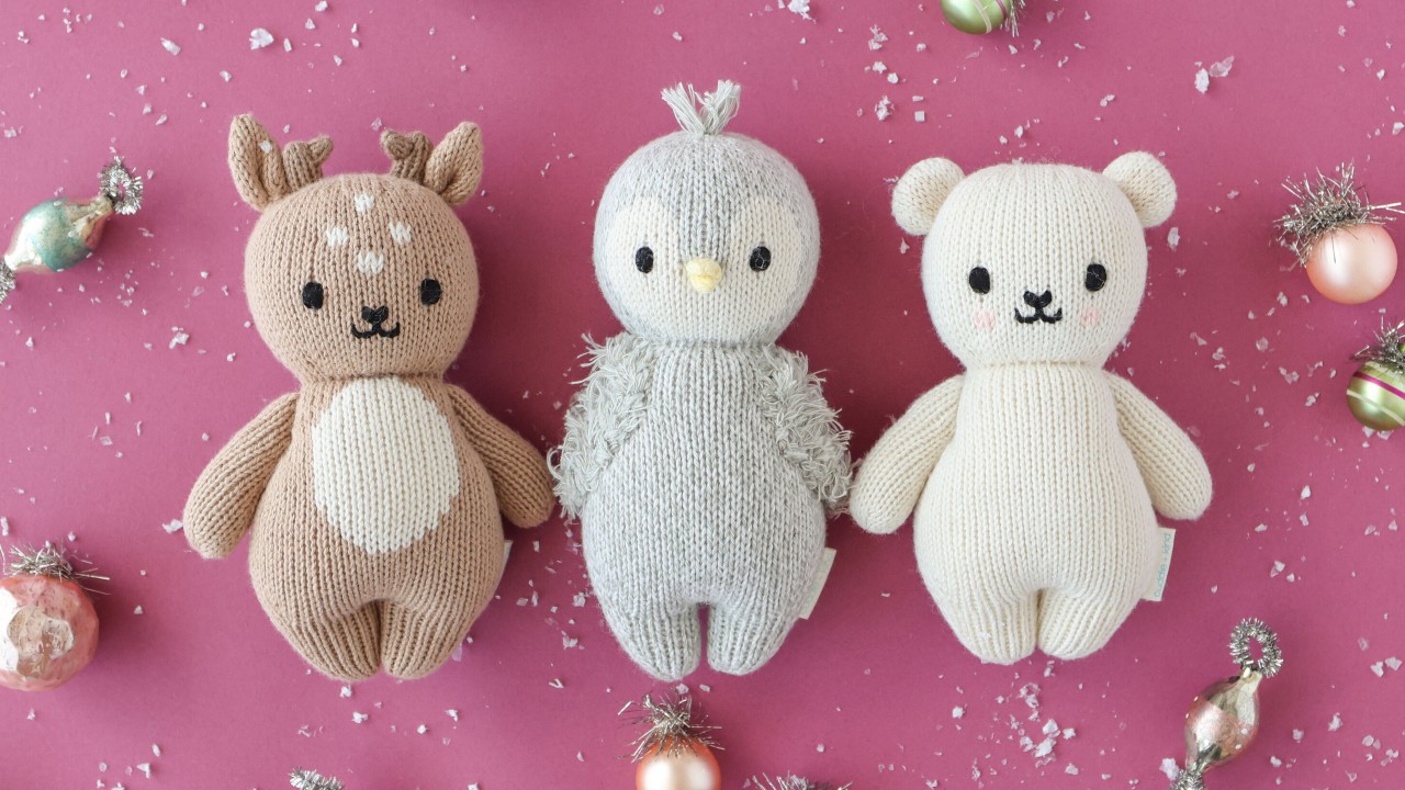 plush baby deer, penguin and sheep on pink festive background