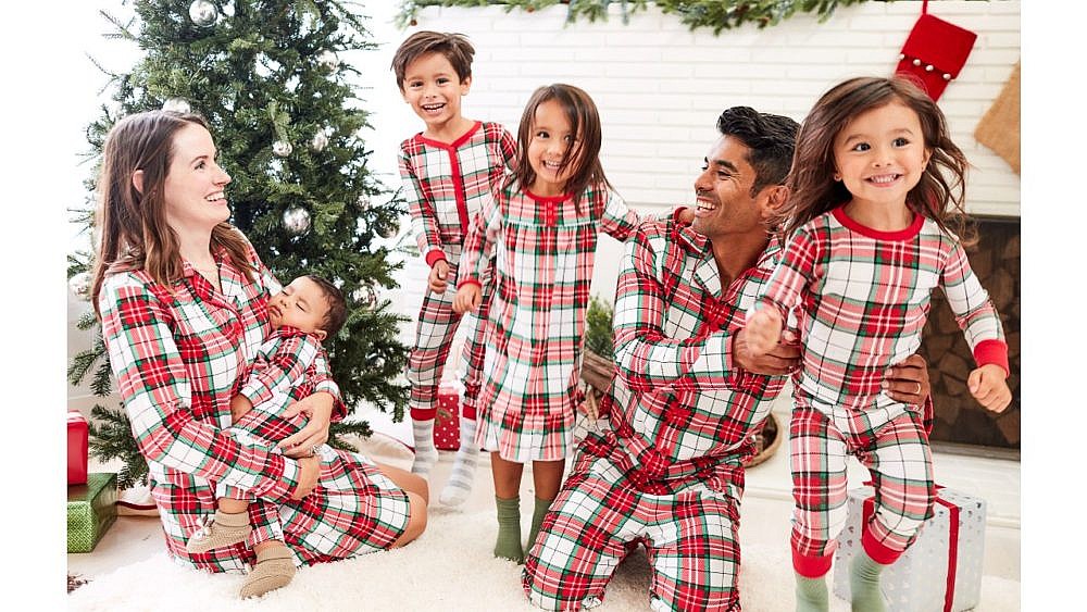 Family wearing red and green plaid pajamas