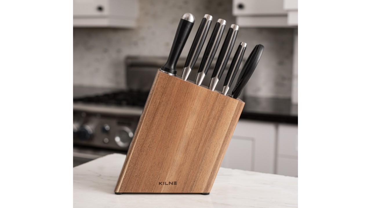 Six-knife set with black handles in wooden block