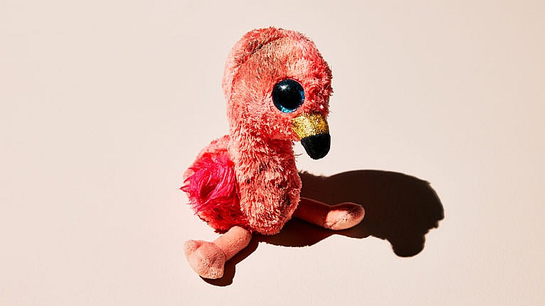 a dirty flamingo stuffed animal