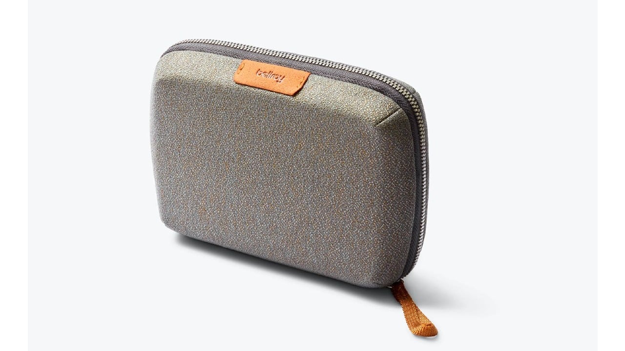 Grey zippered pouch to carry tech accessories