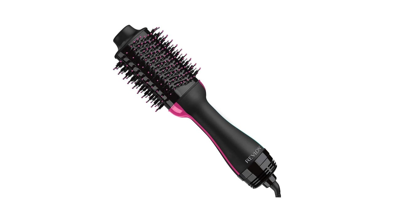 An image of a black Denman brush with pink along the sides and on the bristles.