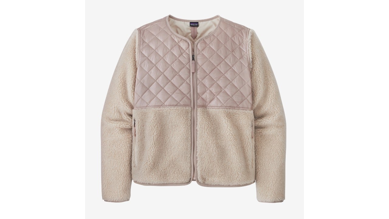 Cream coloured fleece jacket with a light pink quilted pattern at the top