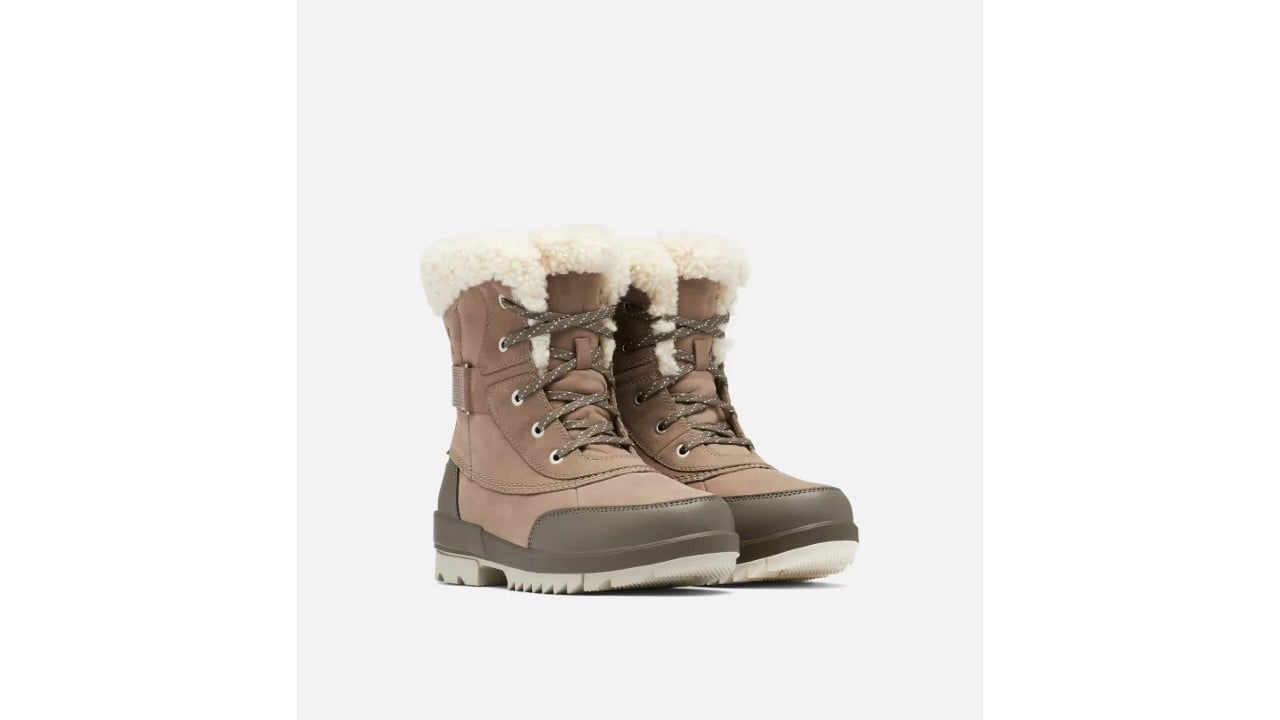 Pair of tan and beige winter boots with white sherpa trim.