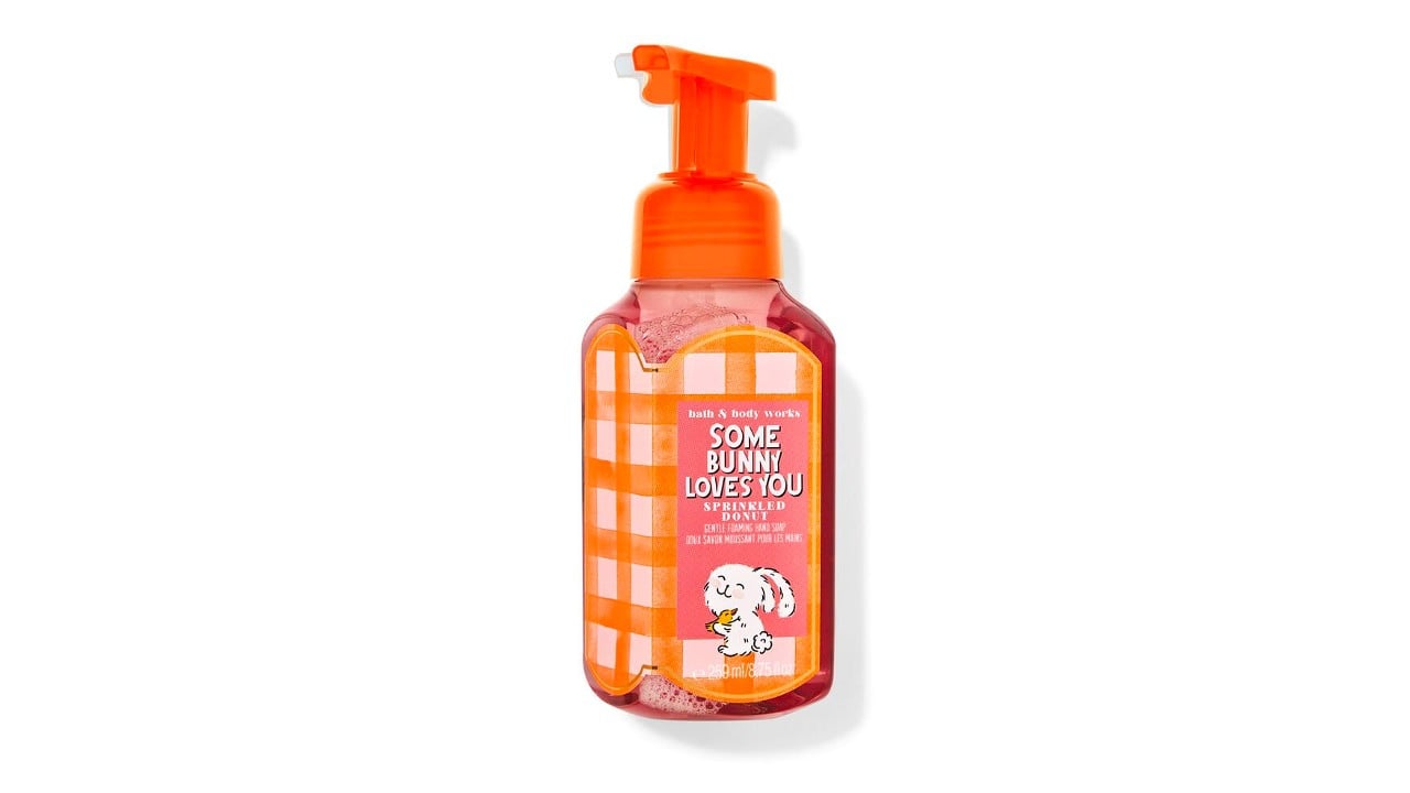A coral coloured hand soap that says "some bunny loves you"