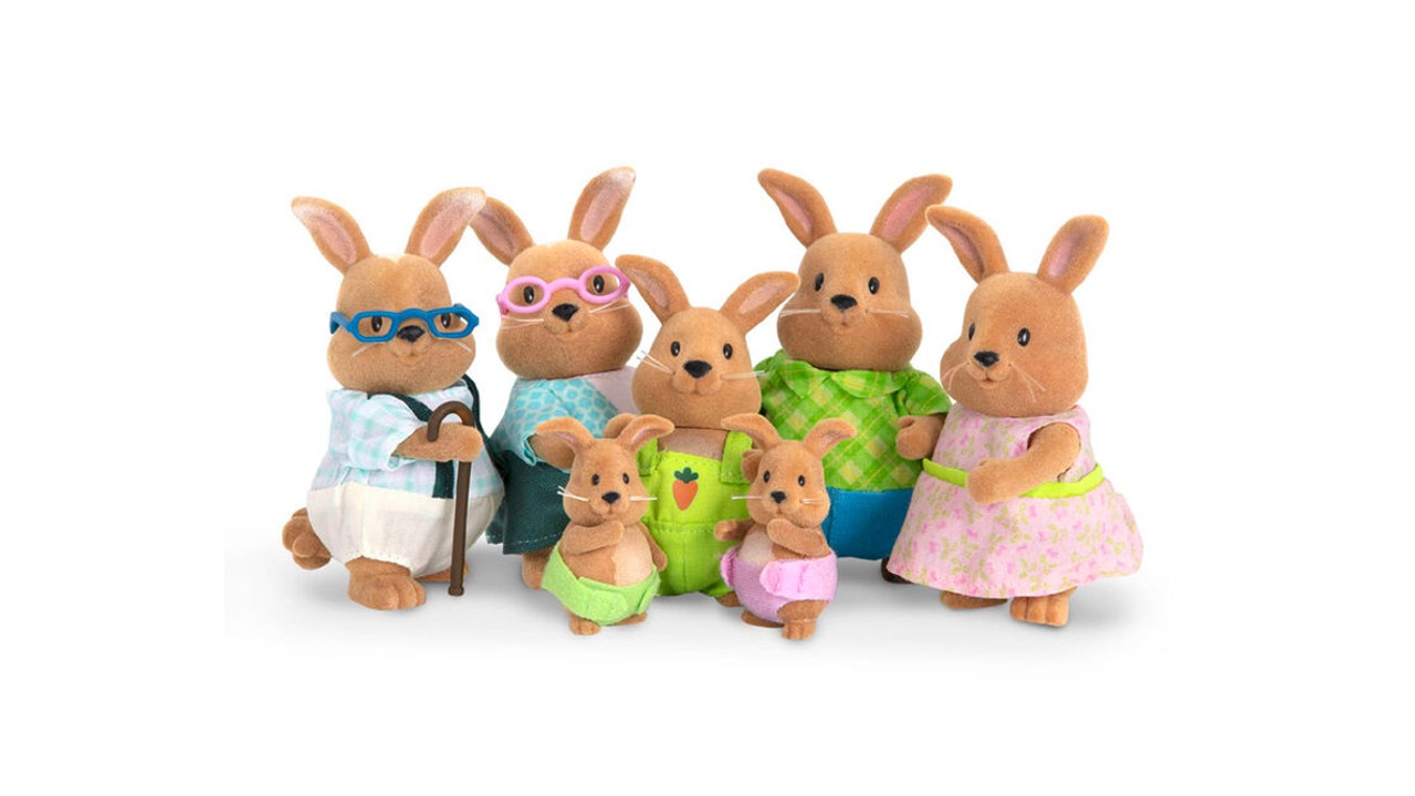 A family of brown plush rabbit stuffed animals. They're all wearing different outfits.
