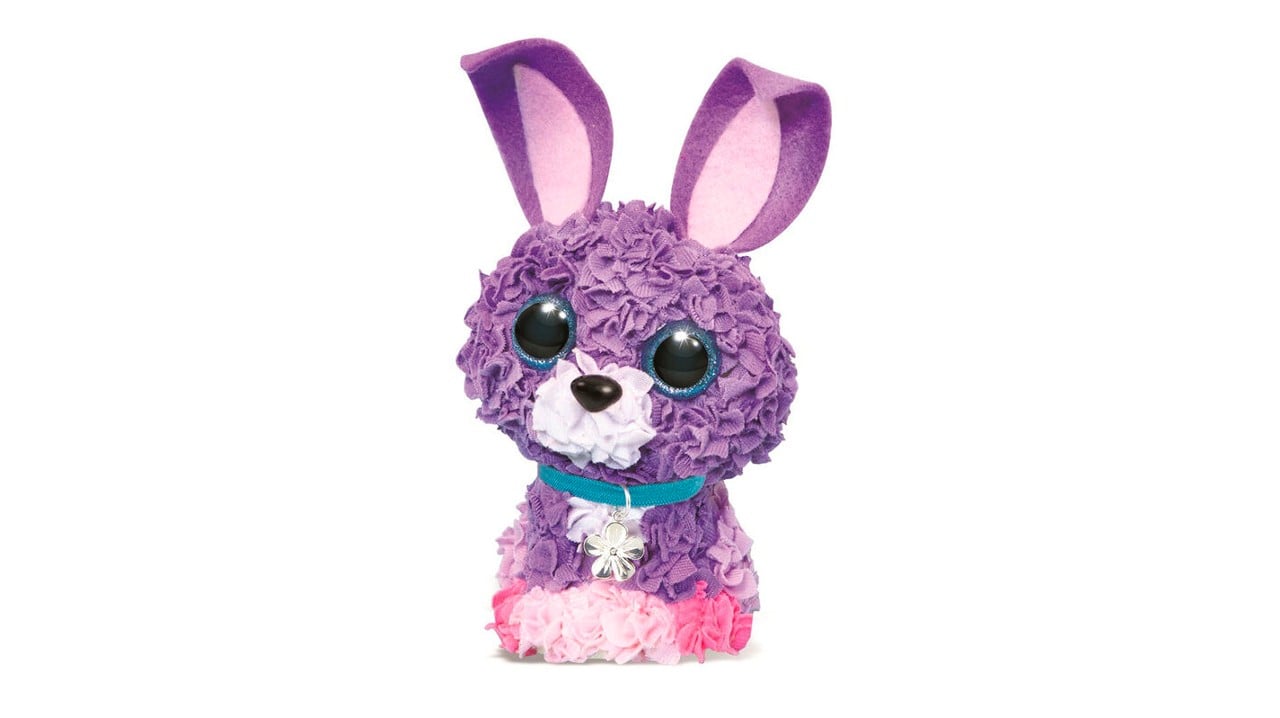 A plush purple and pink stuffed bunny with big eyes and ears.
