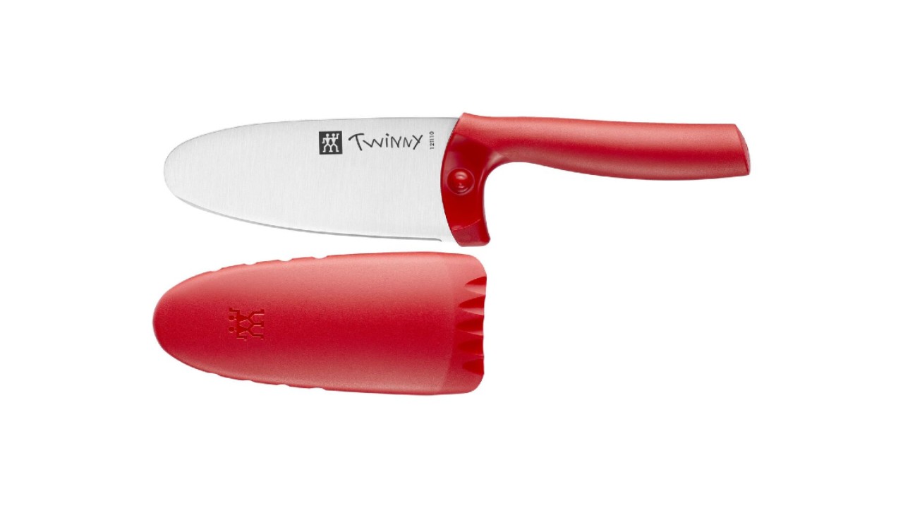 An image of a kids' knife with a red handle and cover.
