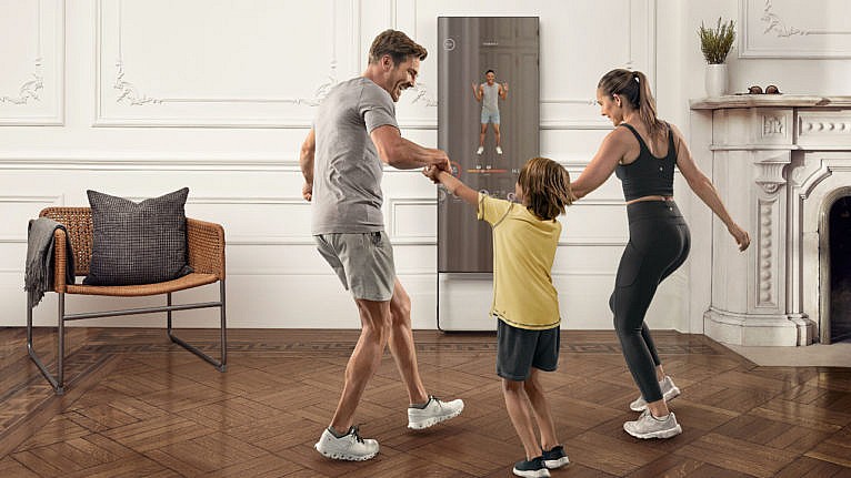 Family working out in front of the Lululemon Mirror