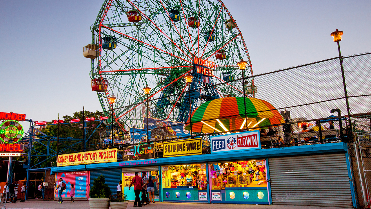 The Wonder Wheel in New York City's Coney Island sits behind a row of booths