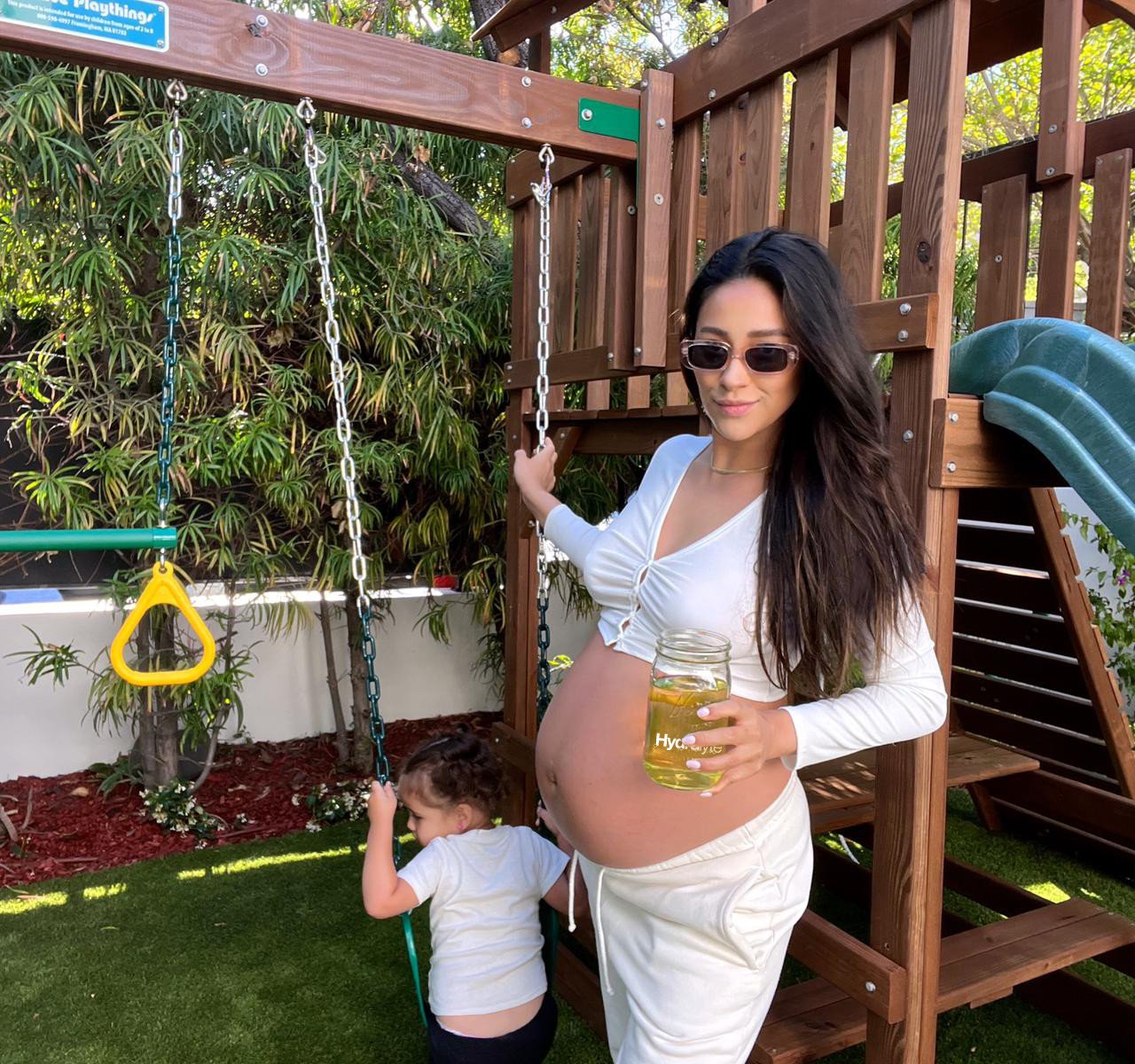 Shay Mitchell with daughter Atlas, holding Hydralyte, her pregnancy hack