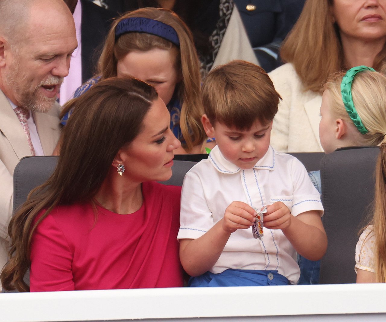 Prince Louis opens a snack while Kate watches at the Platinum Jubilee pageant