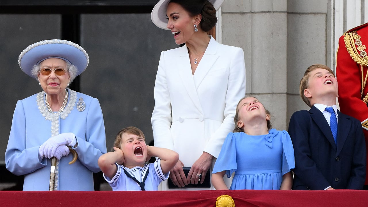 Prince Louis screams and covers his ears while watching the royal flypast on the balcony with his family at Trooping the Colour