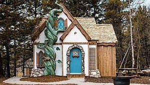 The front door of a storybook cottage at Charmed Resorts in Alberta