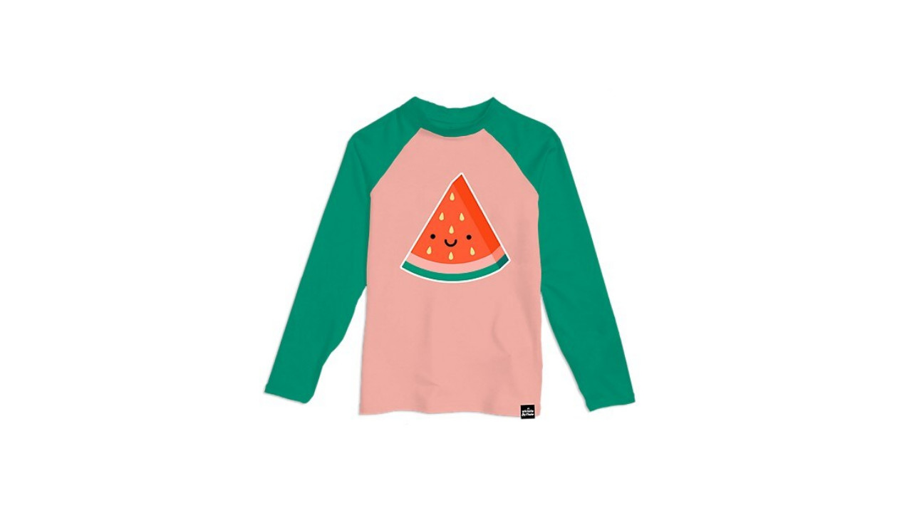 Pink and green rashguard with an image of a watermelon with a smiley face in the center 