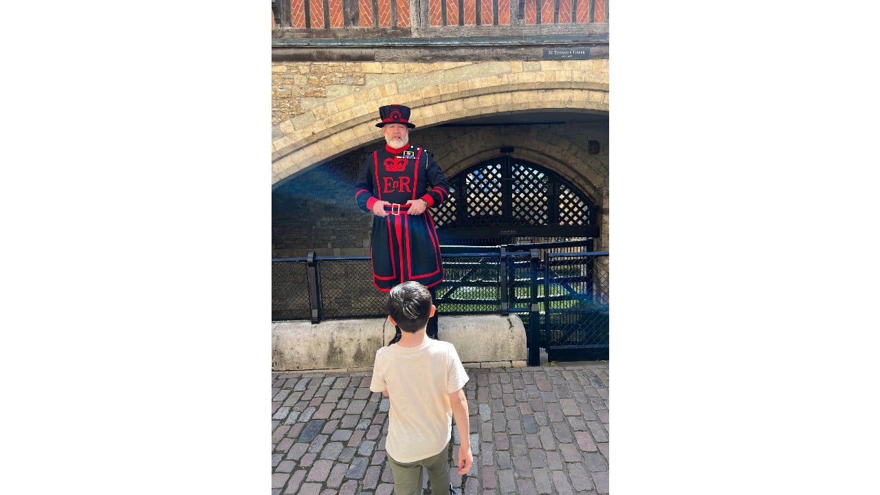 Child walking towards a Yeoman Warder at the Tower of London