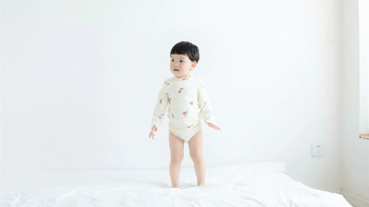 A child models gender-neutral clothing from Norsu Organic