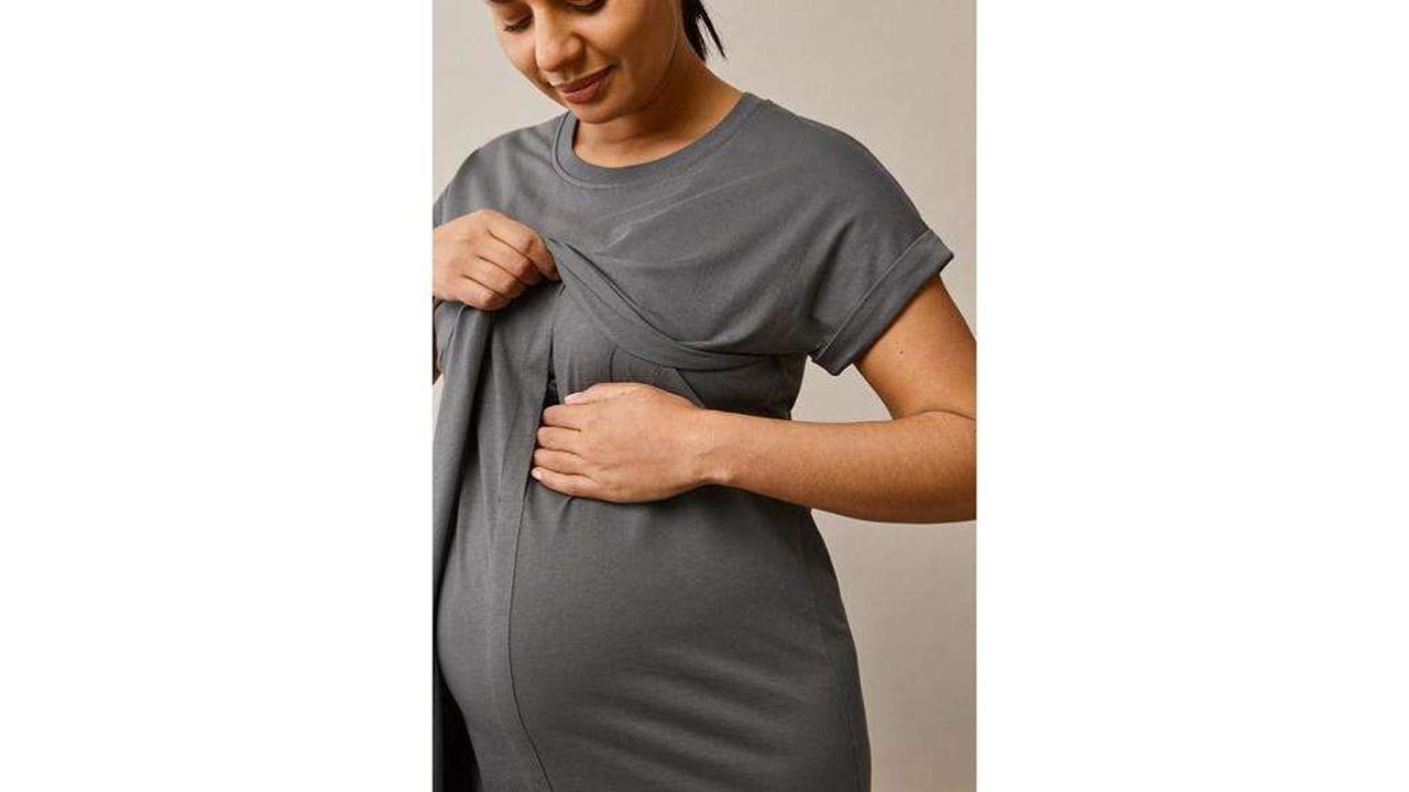 Pregnant woman wearing a grey nursing t-shirt dress