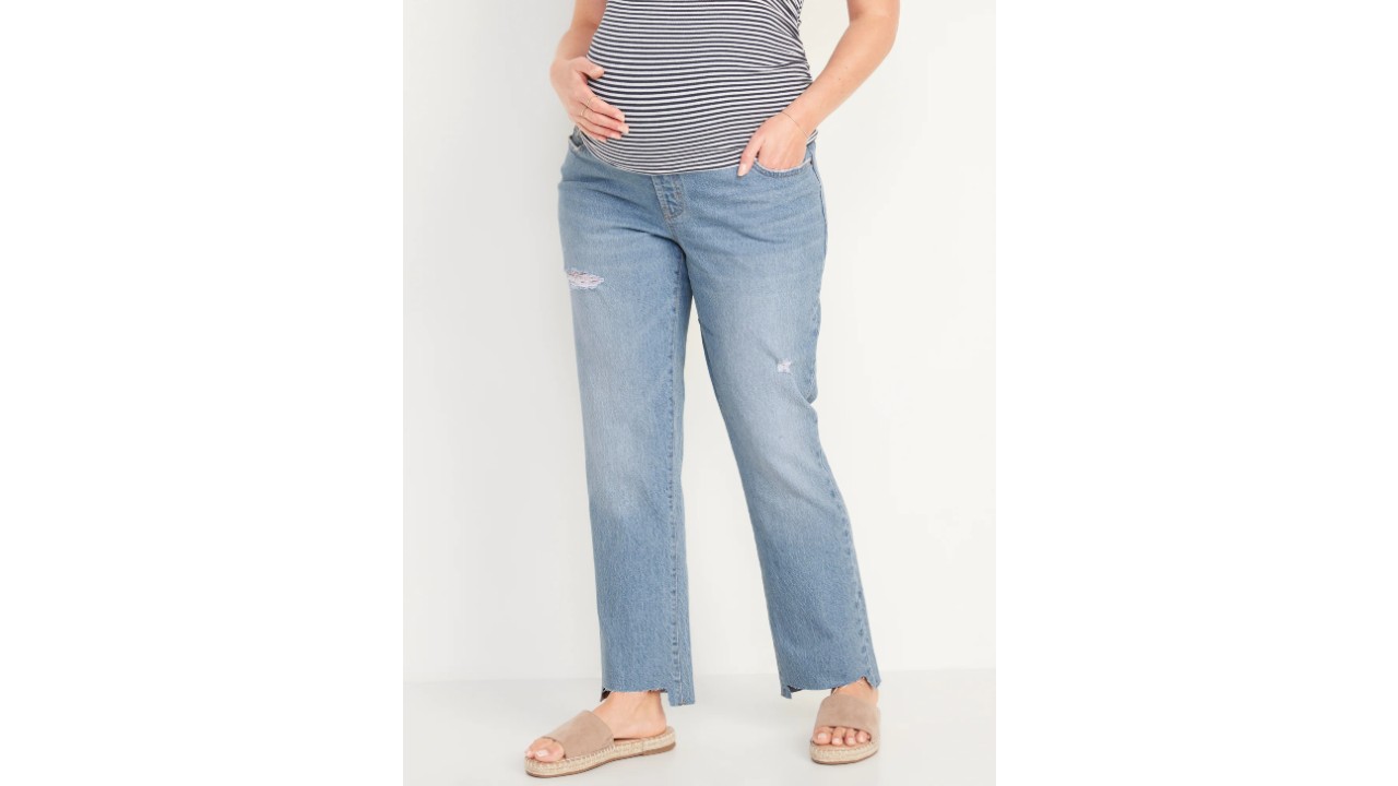 Pregnant woman wearing straight cut distressed jeans