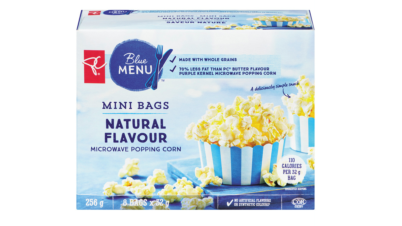 a box of mini bags of PC blue menu popcorn