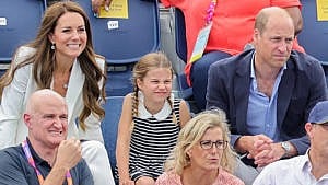 Princess Charlotte squints while watching the Commonwealth Games in the stands with Prince William and Kate Middleton