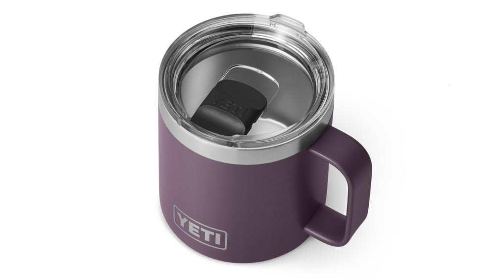 A purple Yeti Rambler mug.