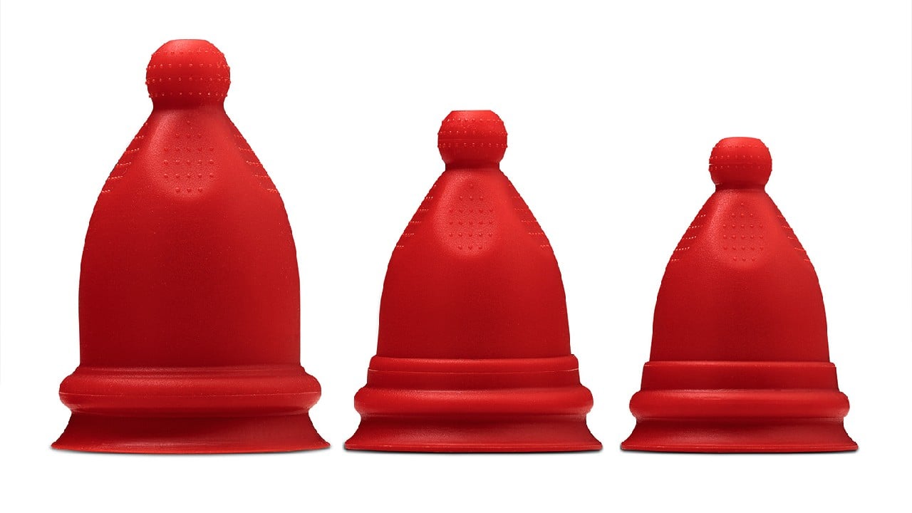 three sizes of red period cups