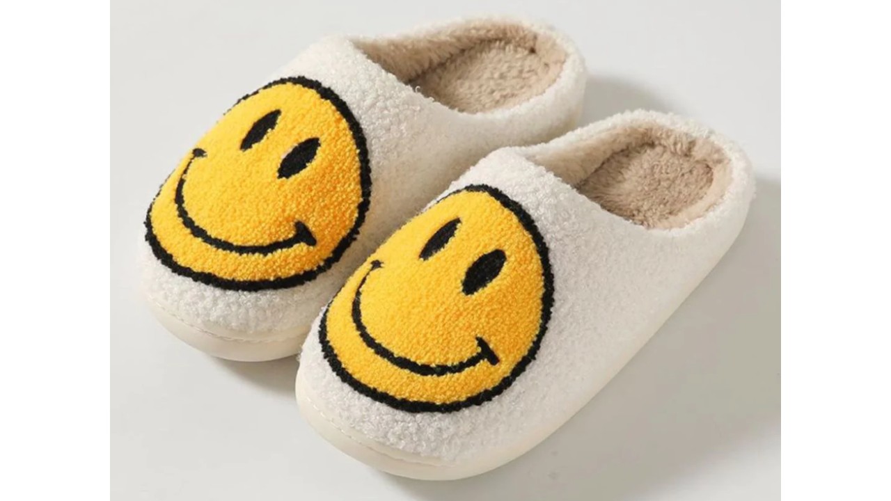 white fuzzy slippers with yellow smiley face