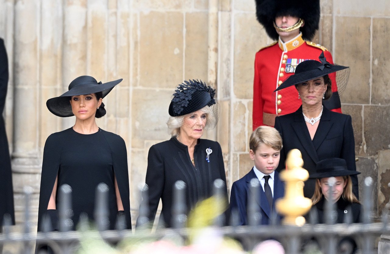 Meghan, Camilla and Kate stand with George and Charlotte outside the Queen's funeral.