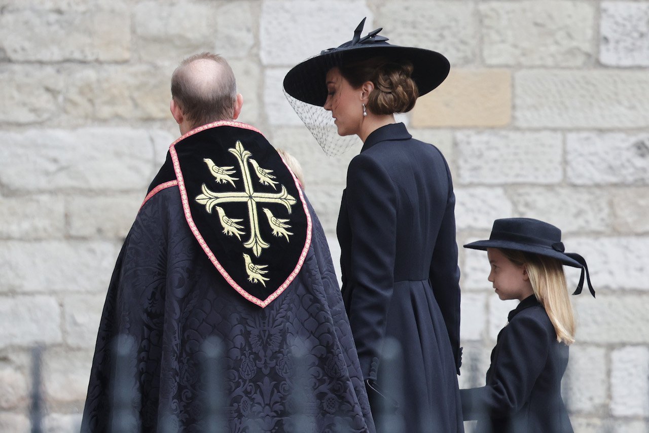 Princess Charlotte and Kate walk into the Queen's funeral at Westminster Abbey.