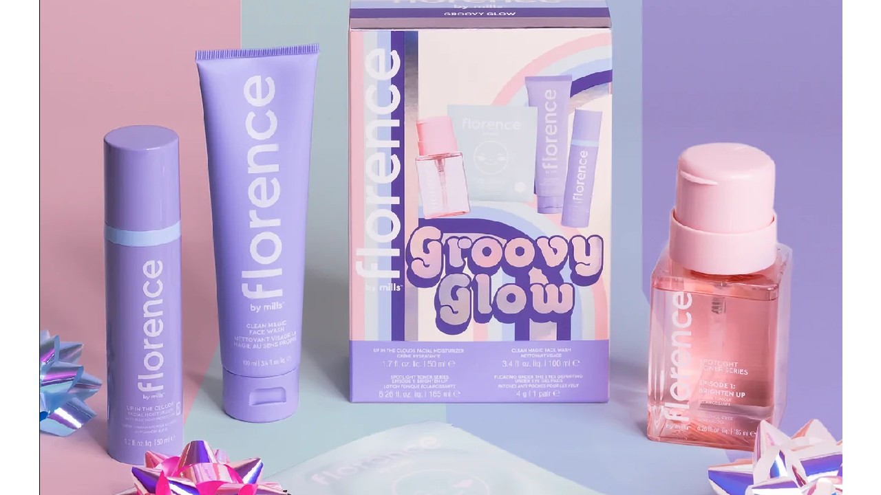 purple skincare products on blue backdrop