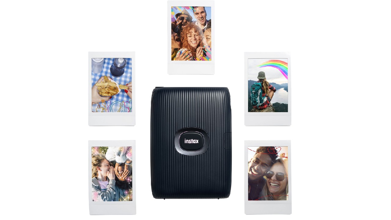 Instax printer surrounded by photos