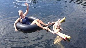 A picture of Jane Johanson and Sue Johanson floating on the water.
