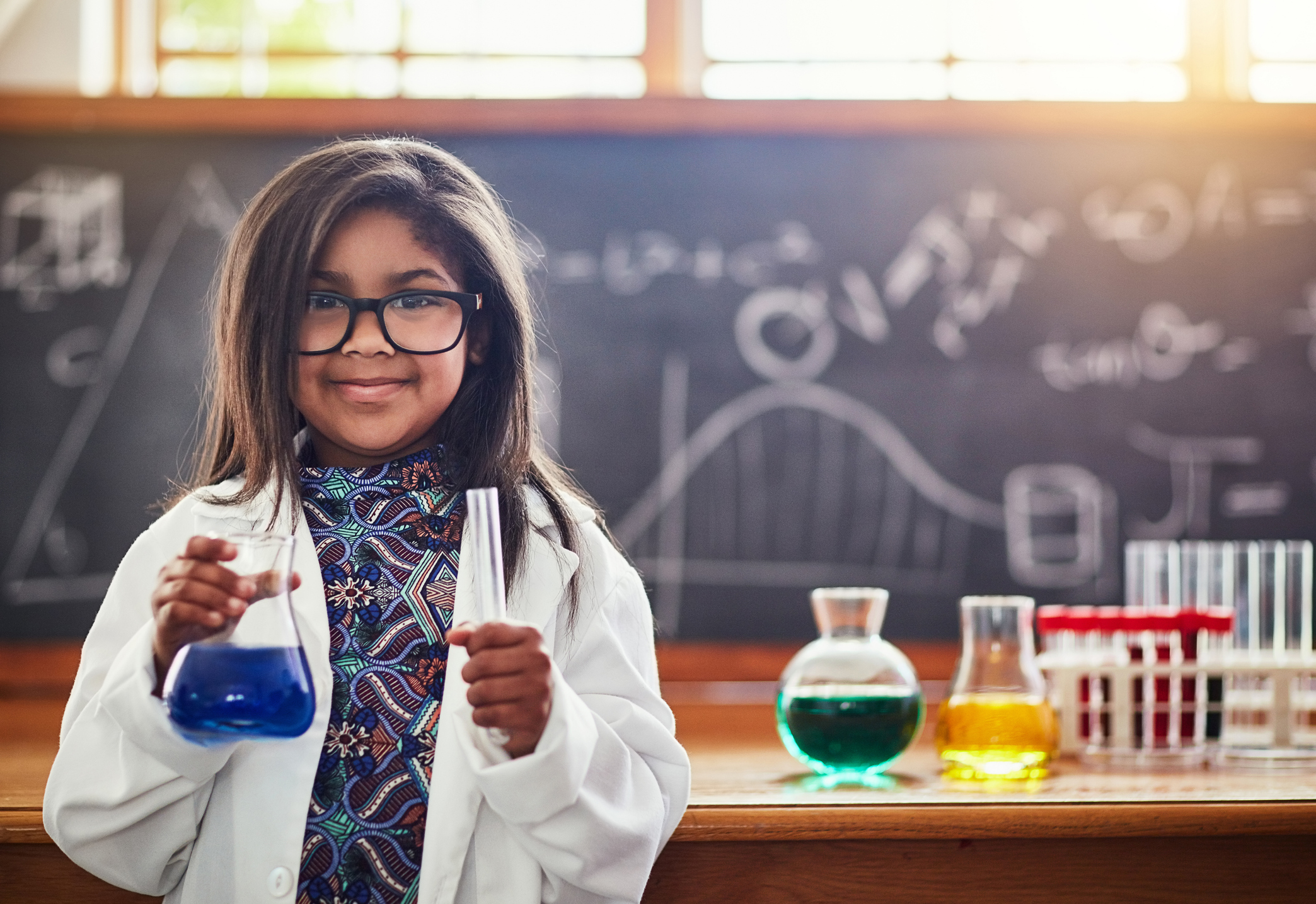 Cropped shot of a cute little girl in a science lab
