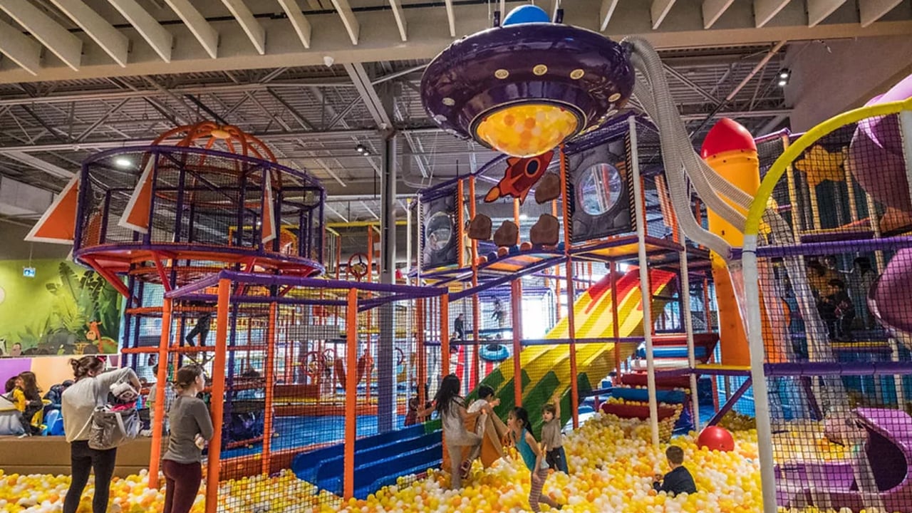 A picture of a ball pit with several playground facilities at Happy Kingdom.