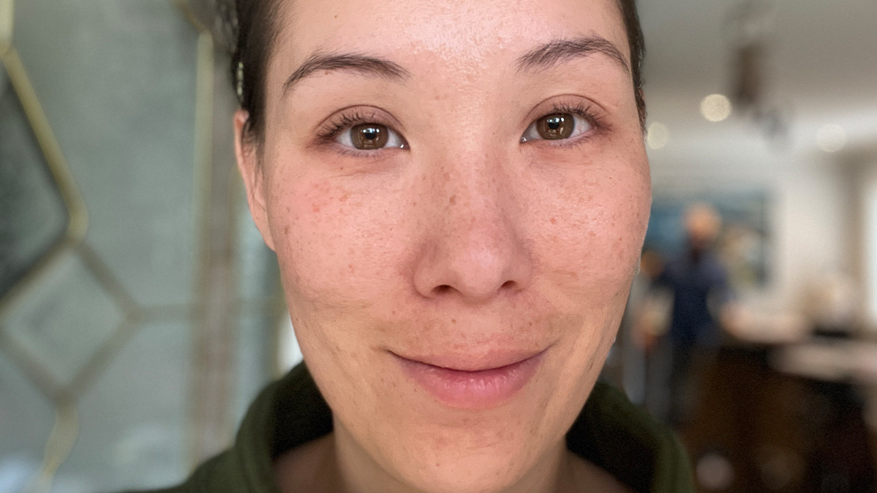 A close-up of a woman's face before getting lash lift and tint.